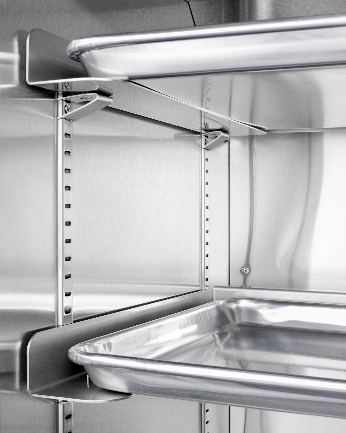 Full-size commercial beverage merchandiser designed for the display and refrigeration of beverages and sealed food, with stainless steel interior, self-closing glass door, sheet pans and adjustable tray supports, chrome shelves, stainless steel cabinet, and removable dolly